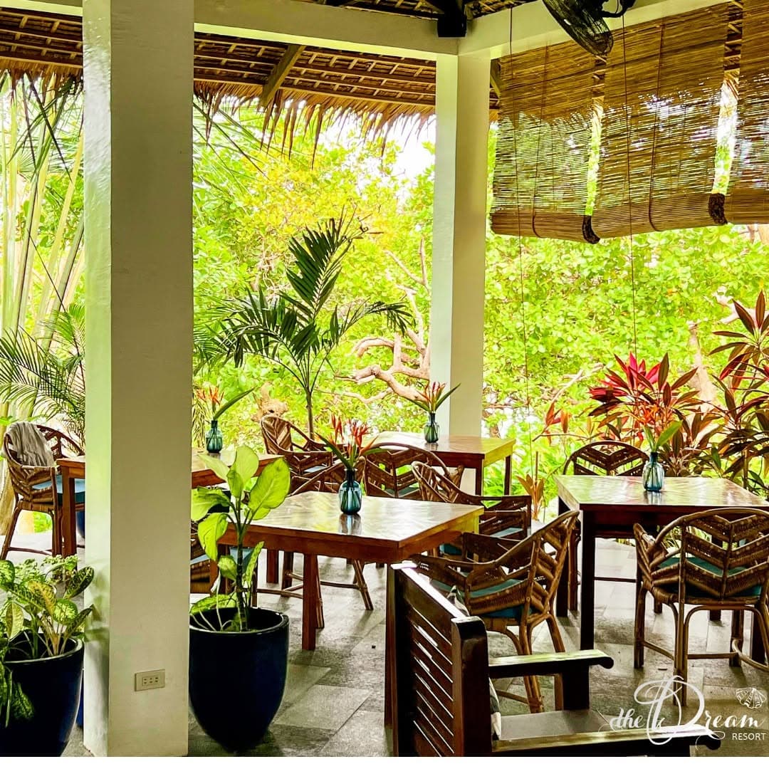 Open-air restaurant in tropical greenery