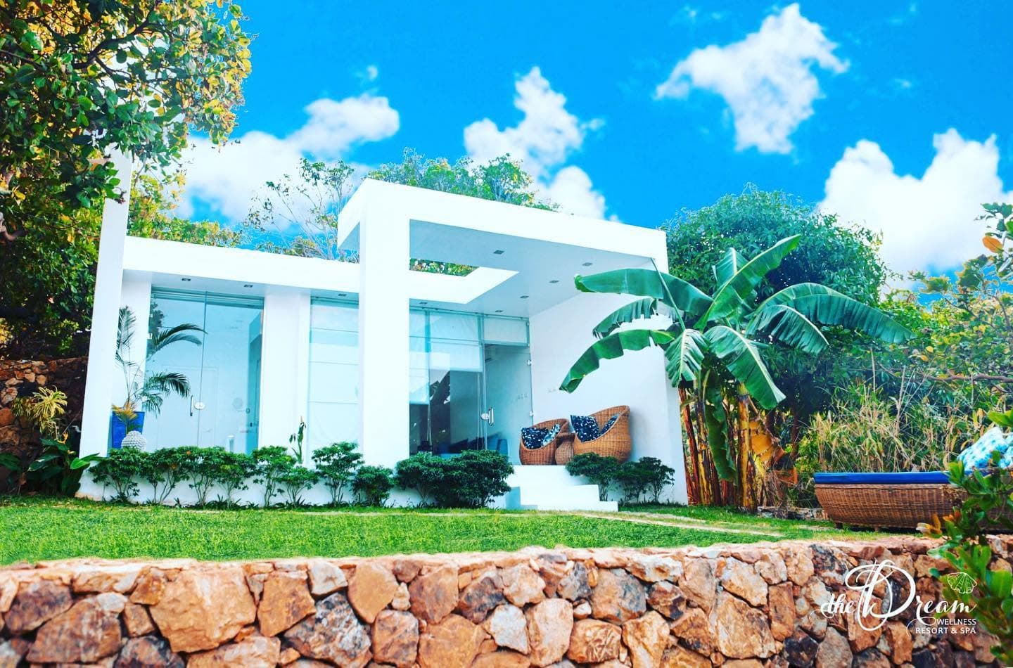 Garden Villa, white and glass, folded into the gardens